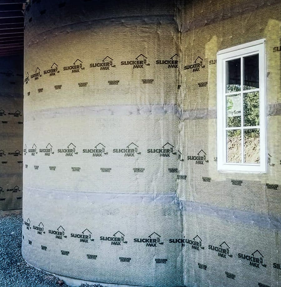 A rounded corner of a home with Slicker® MAX installed