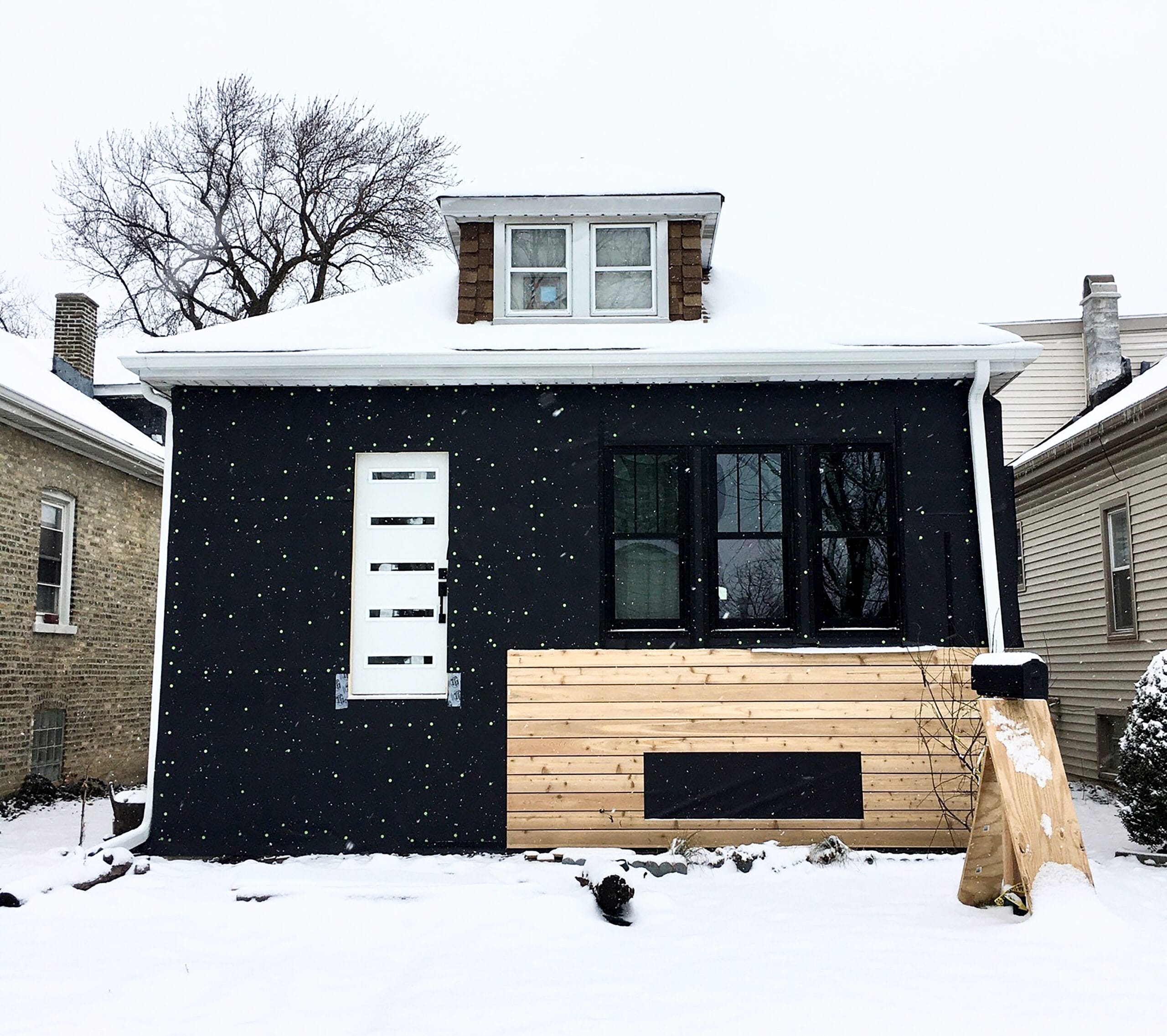 Installation of InvsiWrap UV housewrap in the winter for an open-joint cladding assembly.