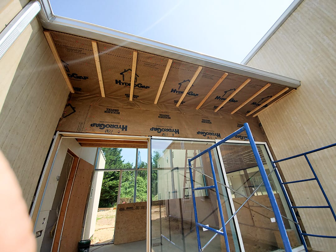 HydroGap drainable housewrap installation onto porch overhang.